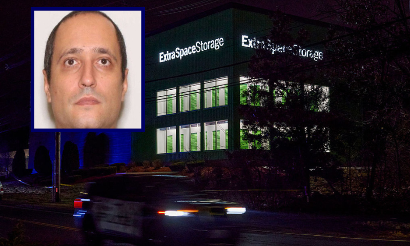 A Salem Police Department cruiser drives past the storage facility where the suspect behind the mass shooting at Brown University was found dead, in Salem, New Hampshire, on December 19, 2025. A man believed to be behind both a mass shooting at Brown University and the killing of an MIT professor has been found dead after a days-long manhunt, authorities said Thursday. The suspect, Claudio Neves Valente, was a 48-year-old Portuguese national who had once studied physics at Brown, officials announced at press conferences in Providence and Boston. (Photo by Bing Guan / AFP via Getty Images)