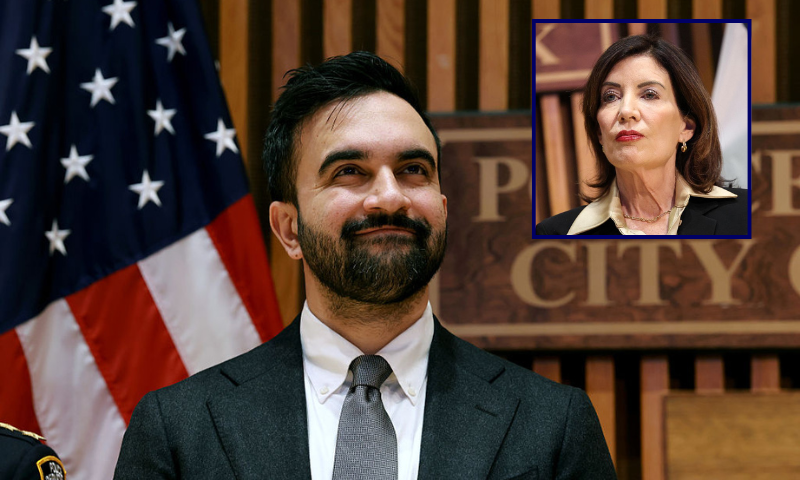(Background) New York City Mayor Zohran Mamdani attends a news conference at the headquarters of the NYPD on January 06, 2026 in New York City. Mamdani, who was joined by New York Gov. Kathy Hochul and Police Commissioner Jessica Tisch, discussed crime statistics and safety, including a historic drop in shootings in New York City last year. (Photo by Spencer Platt/Getty Images) / (R) New York Governor Kathy Hochul looks on during a public safety-related announcement at the headquarters of the New York City Police Department (NYPD) in New York on January 6, 2026. (Photo by CHARLY TRIBALLEAU / AFP via Getty Images)