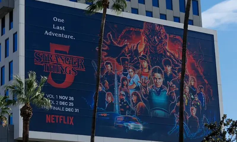 The Netflix logo and an advertisement for "Stranger Things" are shown on one of their buildings in the Hollywood neighborhood of Los Angeles, California, U.S., December 2, 2025. REUTERS/Mike Blake