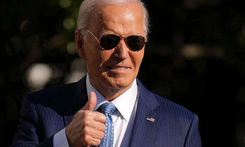 WASHINGTON, DC - NOVEMBER 25: U.S. President Joe Biden motions to the audience after pardoning the National Thanksgiving Turkey Peach during a ceremony on the South Lawn of the White House on November 25, 2024 in Washington, DC. Peach, and the alternate turkey Blossom, were raised in Northfield, Minnesota, and continue a White House tradition going back to the Truman administration in 1947. (Photo by Andrew Harnik/Getty Images)
