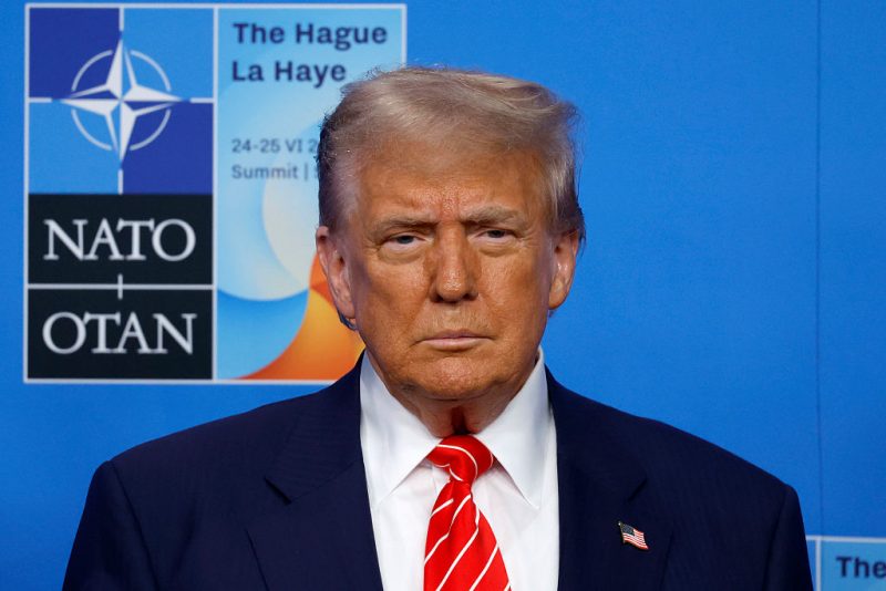 THE HAGUE, NETHERLANDS - JUNE 25: U.S. President Donald Trump looks on as he is greeted by NATO Secretary General Mark Rutte and the Prime Minister of the Netherlands Dick Schoof on the second day of the 2025 NATO Summit on June 25, 2025 in The Hague, Netherlands. Among other matters, members are to approve a new defense investment plan that raises the target for defense spending to 5% of GDP. (Photo by Omar Havana/Getty Images)
