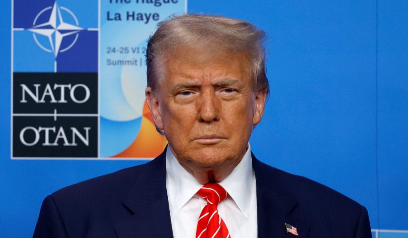 THE HAGUE, NETHERLANDS - JUNE 25: U.S. President Donald Trump looks on as he is greeted by NATO Secretary General Mark Rutte and the Prime Minister of the Netherlands Dick Schoof on the second day of the 2025 NATO Summit on June 25, 2025 in The Hague, Netherlands. Among other matters, members are to approve a new defense investment plan that raises the target for defense spending to 5% of GDP. (Photo by Omar Havana/Getty Images)