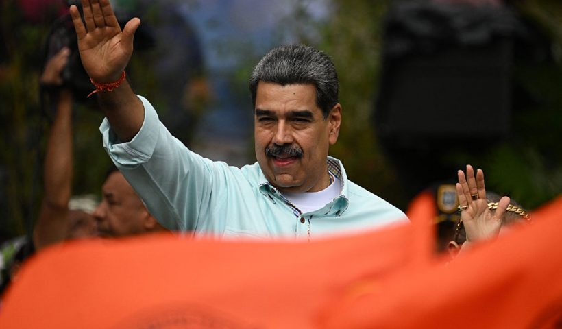 TOPSHOT - Venezuela's President Nicolas Maduro gestures during a rally to mark the anniversary of the Battle of Santa Ines, in Caracas on December 10, 2025. (Photo by Federico PARRA / AFP via Getty Images)