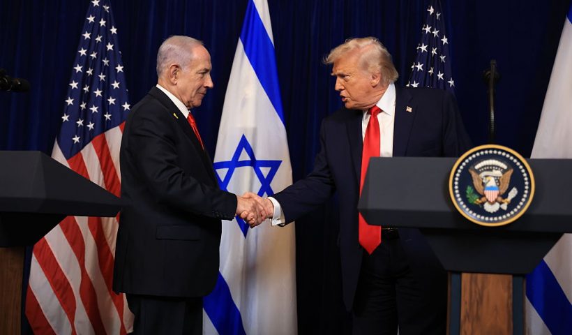PALM BEACH, FLORIDA - DECEMBER 29: U.S. President Donald Trump shakes hands with Israeli Prime Minister Benjamin Netanyahu during a press conference at his Mar-a-Lago club on December 29, 2025 in Palm Beach, Florida. The two leaders held a bilateral meeting to discuss regional security in the Middle East as well as the U.S.-Israel partnership. (Photo by Joe Raedle/Getty Images)