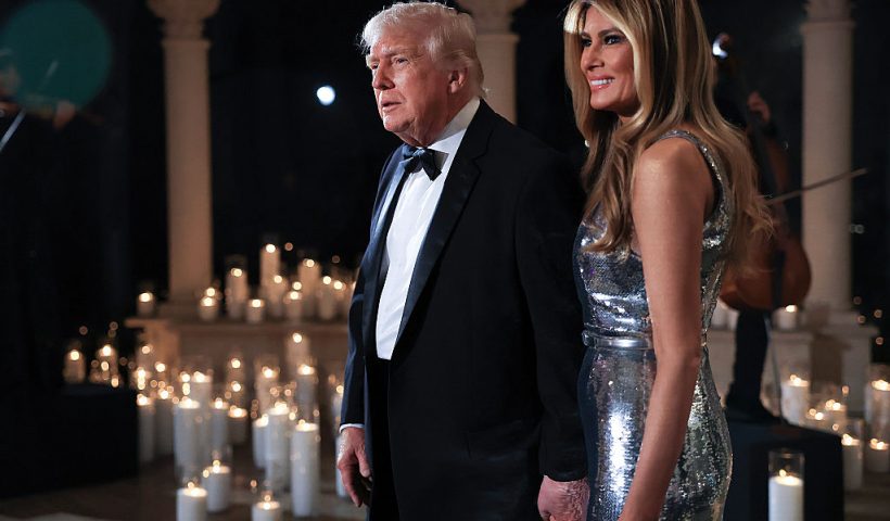 PALM BEACH, FLORIDA - DECEMBER 31: U.S. President Donald Trump and first lady Melania Trump arrive for a New Year’s Eve event at his Mar-a-Lago home on December 31, 2025 in Palm Beach, Florida. The president addressed guests and celebrated the arrival of 2026. (Photo by Joe Raedle/Getty Images)
