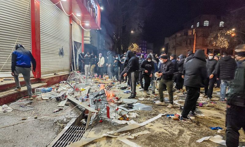 Iranians gather while blocking a street during a protest in Kermanshah, Iran on January 8, 2026. The nationwide protests started in Tehran's Grand Bazaar against the failing economic policies in late December, which spread to universities and other cities, and included economic slogans, to political and anti-government ones. (Photo by Kamran / Middle East Images / AFP via Getty Images)