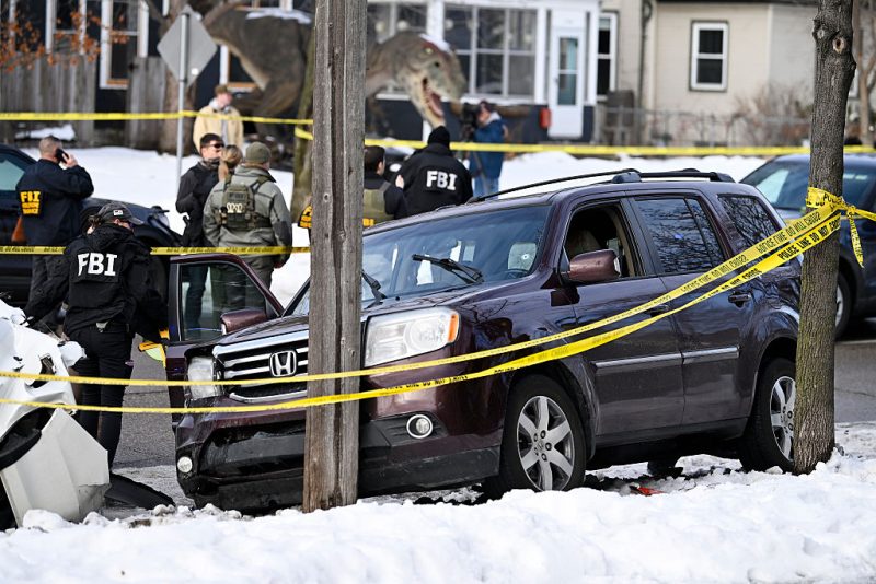 MINNEAPOLIS, MINNESOTA - JANUARY 07: Members of law enforcement work the scene following a suspected shooting by an ICE agent during federal law enforcement operations on January 07, 2026 in Minneapolis, Minnesota. According to federal officials, the agent, “fearing for his life” killed a woman during a confrontation in south Minneapolis. (Photo by Stephen Maturen/Getty Images)