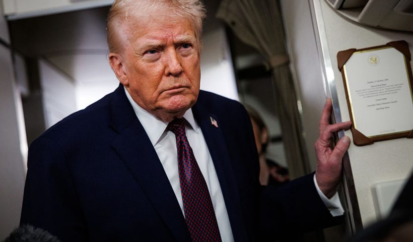 IN FLIGHT - JANUARY 11: U.S. President Donald Trump takes questions from the members of the press aboard Air Force One on January 11, 2026 en route back to the White House from Palm Beach, Florida. The President spent the weekend at his private club Mar-a-Lago in Palm Beach, Florida. (Photo by Samuel Corum/Getty Images)