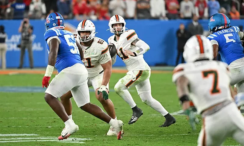 Carson Beck #11 of the Miami Hurricanes looks to throw the ball against the Ole Miss Rebels during the 2025 College Football Playoff Semifinal at the VRBO Fiesta Bowl at State Farm Stadium on January 08, 2026 in Glendale, Arizona. (Photo by Norm Hall/Getty Images)