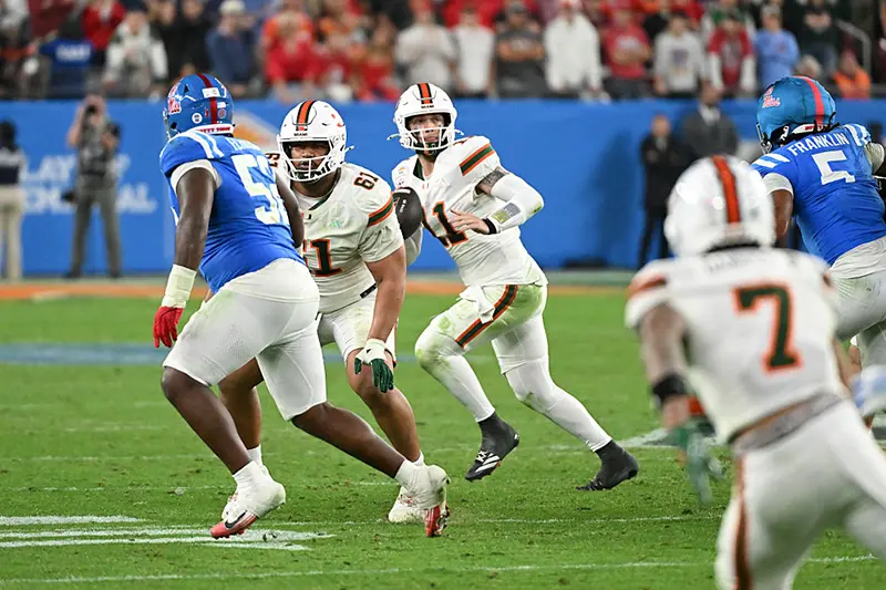 Carson Beck #11 of the Miami Hurricanes looks to throw the ball against the Ole Miss Rebels during the 2025 College Football Playoff Semifinal at the VRBO Fiesta Bowl at State Farm Stadium on January 08, 2026 in Glendale, Arizona. (Photo by Norm Hall/Getty Images)