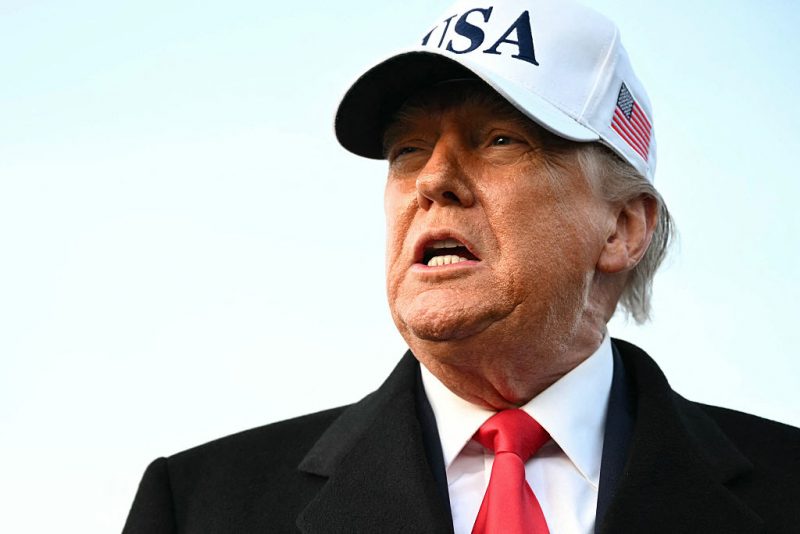 US President Donald Trump speaks to the press upon returning to Joint Base Andrews in Maryland on January 13, 2026. Trump is returning from speaking to The Detroit Economic Club in Detroit, Michigan, and a visit to a Ford production plant. (Photo by Mandel NGAN / AFP via Getty Images)