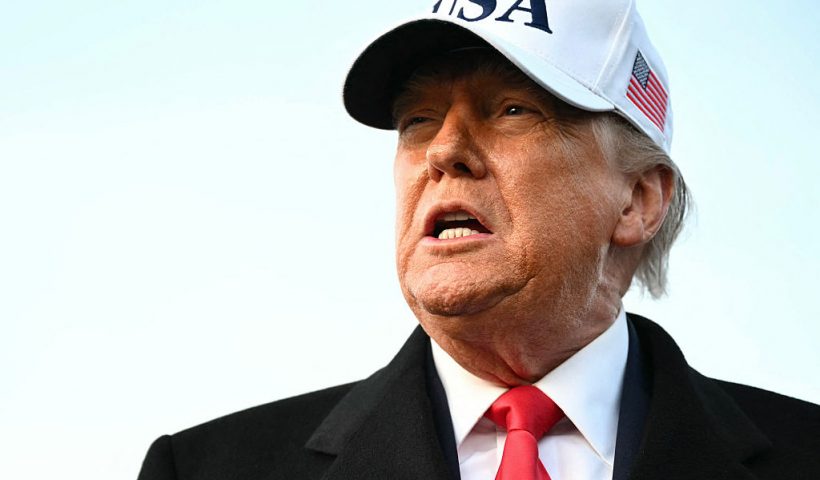 US President Donald Trump speaks to the press upon returning to Joint Base Andrews in Maryland on January 13, 2026. Trump is returning from speaking to The Detroit Economic Club in Detroit, Michigan, and a visit to a Ford production plant. (Photo by Mandel NGAN / AFP via Getty Images)