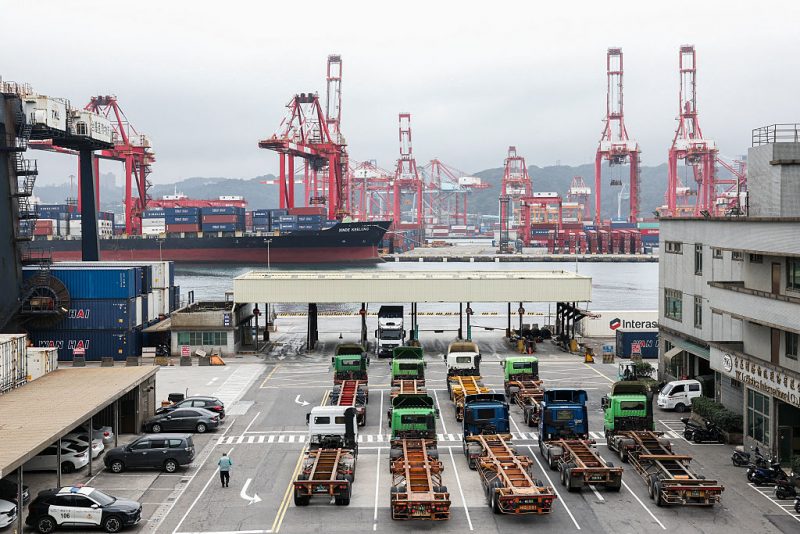 Gantry cranes and shipping containers are seen at the port in Keelung on January 16, 2026. The United States said on January 15 that it has signed a deal with Taiwan to reduce tariffs on goods from the democratic island, while increasing Taiwanese semiconductor and tech companies' investments in America. (Photo by I-Hwa Cheng / AFP via Getty Images)