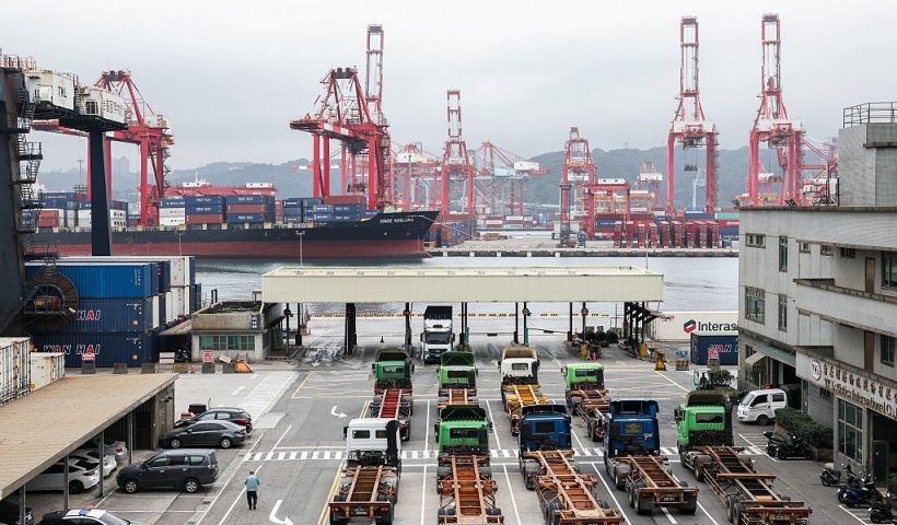 Gantry cranes and shipping containers are seen at the port in Keelung on January 16, 2026. The United States said on January 15 that it has signed a deal with Taiwan to reduce tariffs on goods from the democratic island, while increasing Taiwanese semiconductor and tech companies' investments in America. (Photo by I-Hwa Cheng / AFP via Getty Images)
