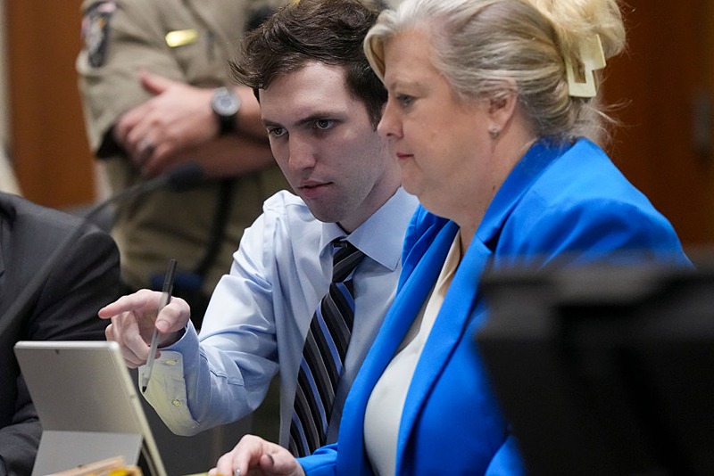 PROVO, UTAH - JANUARY 16: Tyler Robinson, left, accused in the fatal shooting of Charlie Kirk, points with defense attorney Kathryn Nester during a hearing in 4th District Court on January 16, 2026 in Provo, Utah. Prosecutors have charged Tyler Robinson with aggravated murder and plan to seek the death penalty. (Photo by Bethany Baker-Pool/Getty Images)