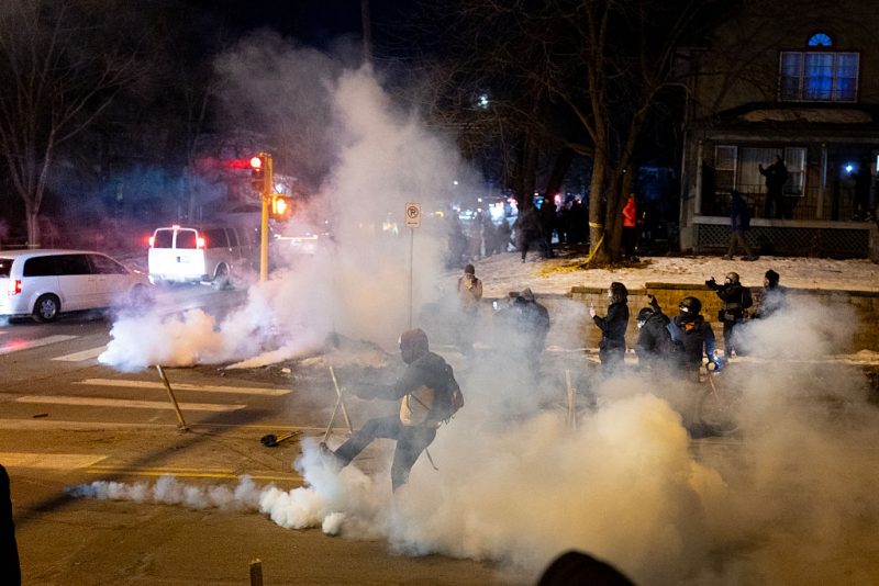 MINNEAPOLIS, MINNESOTA - JANUARY 14: Federal agents launch tear gas at residents protesting a shooting incident on January 14, 2026 in Minneapolis, Minnesota. According to reports, a federal agent shot a Venezuelan man who was resisting arrest. The Trump administration has sent a reported 2,000 federal plus federal agents into the area, with more on the way, as they make a push to arrest undocumented immigrants in the region. (Photo by Scott Olson/Getty Images)