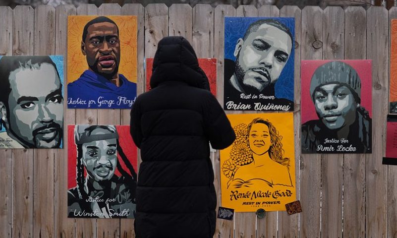 MINNEAPOLIS, MINNESOTA - JANUARY 15: A poster featuring the likeness of Renee Good hangs alongside pictures of other homicide victims near a memorial to Good on January 15, 2026 in Minneapolis, Minnesota. Protests have sparked up around the area following the fatal shooting of Renee Good by an immigration enforcement agent during an incident in south Minneapolis on January 7. (Photo by Scott Olson/Getty Images)