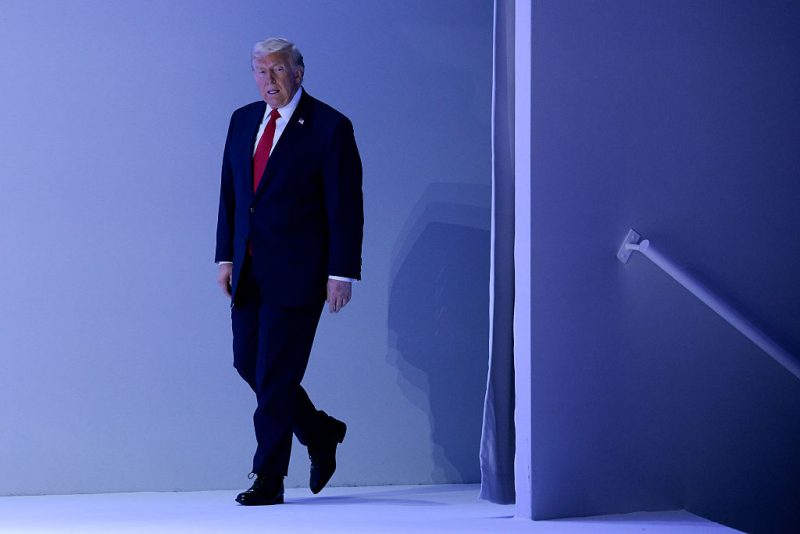 DAVOS, SWITZERLAND - JANUARY 21: U.S. President Donald Trump takes the stage before delivering a speech at the World Economic Forum (WEF) at the Davos Congress Center on January 21, 2026 in Davos, Switzerland. The annual meeting of political and business leaders comes amid rising tensions between the United States and Europe over a range of issues, including Trump's vow to acquire Greenland, a semi-autonomous Danish territory. (Photo by Chip Somodevilla/Getty Images)