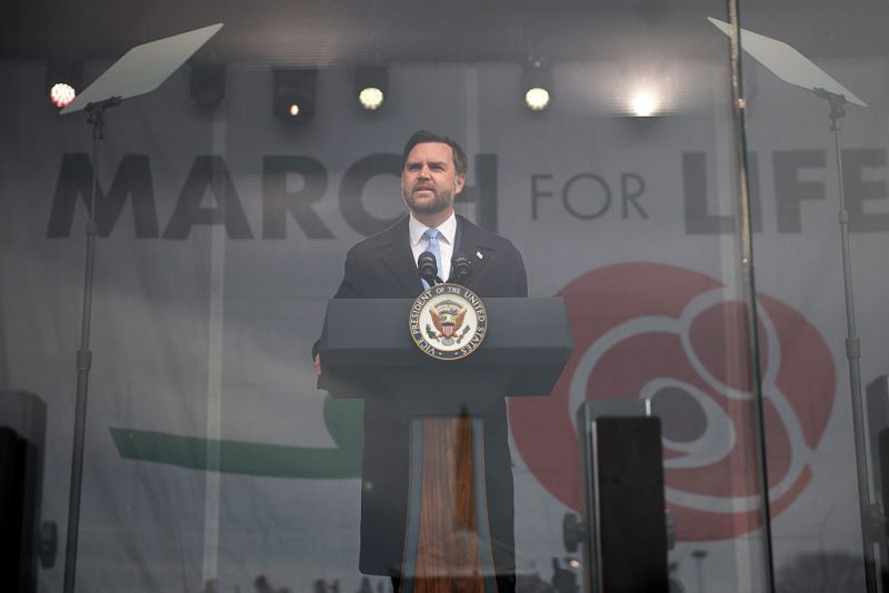WASHINGTON, DC - JANUARY 23: U.S. Vice President JD Vance delivers remarks from behind bulletproof glass during the annual March for Life rally on the National Mall on January 23, 2026 in Washington, DC. Anti-abortion activists attended the annual march to mark the anniversary of the Supreme Court's, now overturned, 1973 Roe v. Wade ruling which legalized abortion in all 50 states. (Photo by Kevin Dietsch/Getty Images)