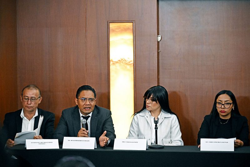 Lawyer Hugo Dionisio Guadalupe speaks next to (L to R) Guadalupe Arturo Guzman Sanchez, Vanesa Guzman, and Yarey Sanchez Lagunas during a press conference in Mexico City on January 26, 2026. Relatives and lawyers representing three of the more than ninety criminals that Mexico has handed over to the United States announced on January 26 that they were filing a lawsuit against the Mexican authorities for violating their rights and called on the relatives of the other deportees to join them. (Photo by Carl de Souza / AFP via Getty Images)