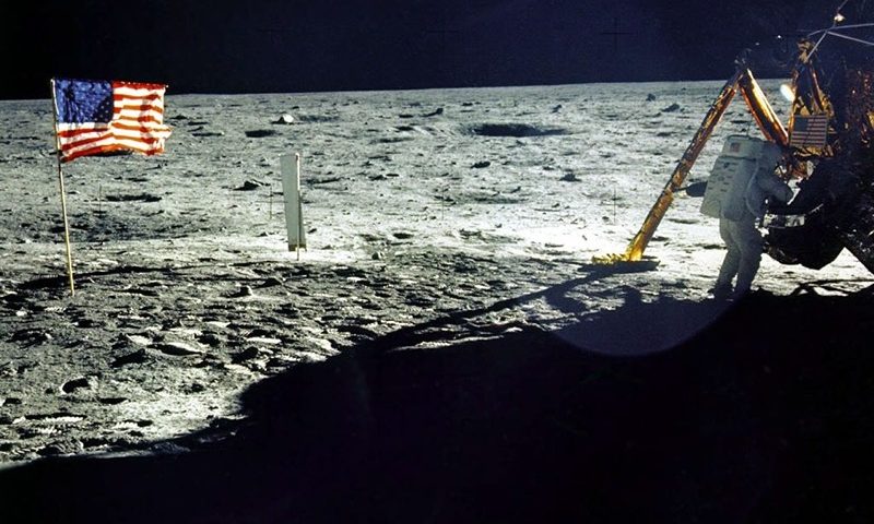 This 20 July, 1969 file photo released by NASA shows the lunar lander and the US flag taken by Apollo 11 astronaut Edwin E. "Buzz" Aldrin, Jr. on the surface of the Moon. The date 20 July, 1999 marks the 30th anniversary of the Apollo 11 mission and man's first walk on the Moon. Astronaut and first man on the moon Neil Armstrong is near the lunar lander at right.