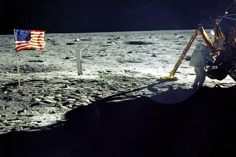 This 20 July, 1969 file photo released by NASA shows the lunar lander and the US flag taken by Apollo 11 astronaut Edwin E. "Buzz" Aldrin, Jr. on the surface of the Moon. The date 20 July, 1999 marks the 30th anniversary of the Apollo 11 mission and man's first walk on the Moon. Astronaut and first man on the moon Neil Armstrong is near the lunar lander at right.