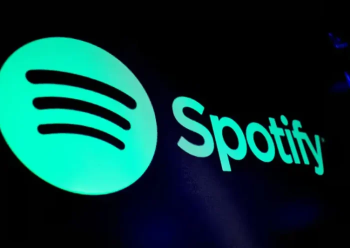 A screen displays the logo of Spotify on the floor at the New York Stock Exchange (NYSE) in New York City, U.S., December 4, 2023. REUTERS/Brendan McDermid/File Photo