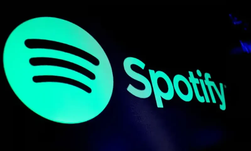 A screen displays the logo of Spotify on the floor at the New York Stock Exchange (NYSE) in New York City, U.S., December 4, 2023. REUTERS/Brendan McDermid/File Photo