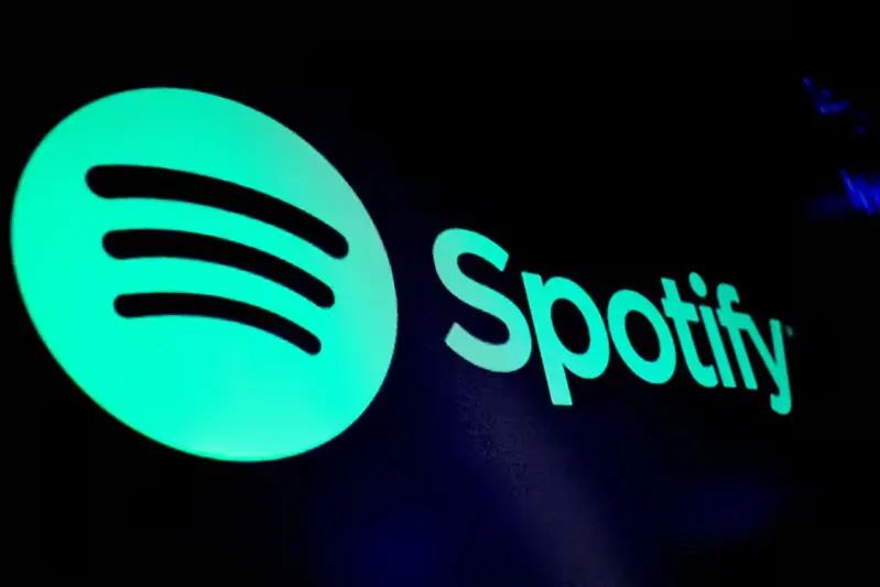 A screen displays the logo of Spotify on the floor at the New York Stock Exchange (NYSE) in New York City, U.S., December 4, 2023. REUTERS/Brendan McDermid/File Photo