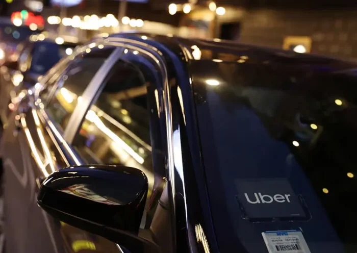 The logo for Uber Technologies is seen on a vehicle in Manhattan, New York City, New York, U.S., November 17, 2021. REUTERS/Andrew Kelly