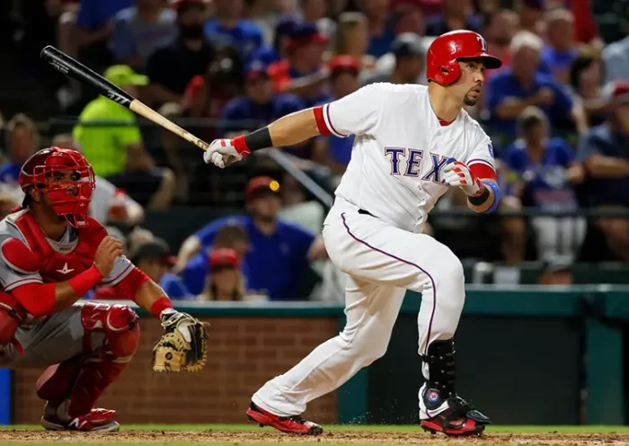 Texas Rangers’ Carlos Beltran follows through on a two-run home run swing as Los Angeles Angels catcher Carlos Perez watches in the fifth inning of a baseball game, Sept. 21, 2016, in Arlington, Texas. (AP Photo/Tony Gutierrez, File)
