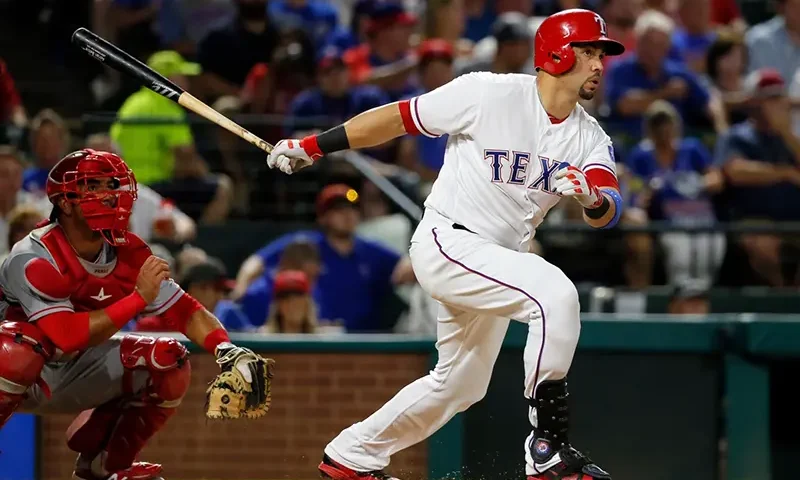 Texas Rangers’ Carlos Beltran follows through on a two-run home run swing as Los Angeles Angels catcher Carlos Perez watches in the fifth inning of a baseball game, Sept. 21, 2016, in Arlington, Texas. (AP Photo/Tony Gutierrez, File)