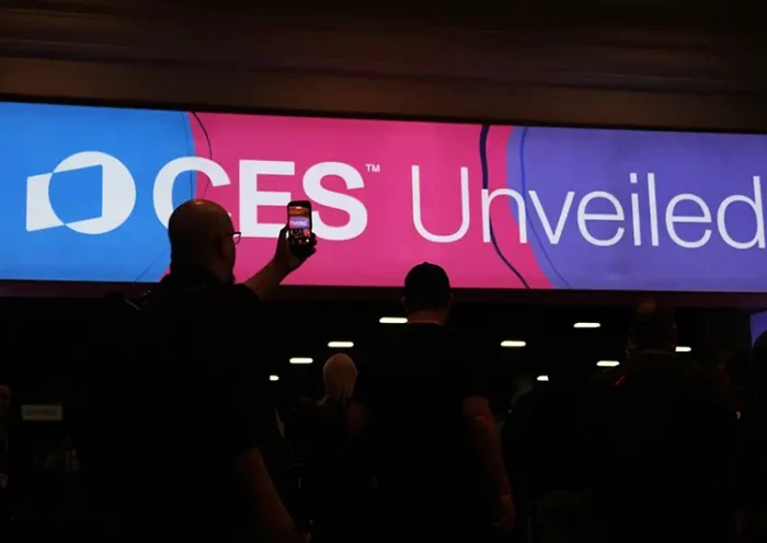 People arrive at the CES Unveiled tech show Sunday, Jan. 4, 2026, in Las Vegas. (AP Photo/Abbie Parr)