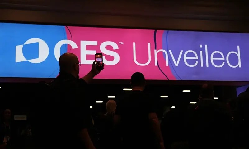 People arrive at the CES Unveiled tech show Sunday, Jan. 4, 2026, in Las Vegas. (AP Photo/Abbie Parr)