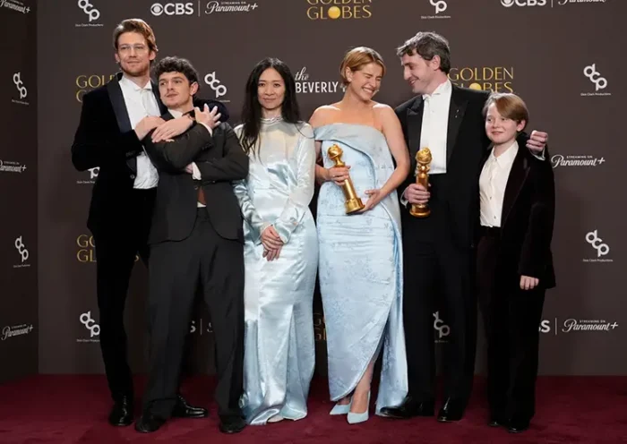 Joe Alwyn, from left, Noah Jupe, Chloe Zhao, Jessie Buckley, Paul Mescal, and Jacobi Jupe pose in the press room with the award for best motion picture - drama for “Hamnet” during the 83rd Golden Globes on Sunday, Jan. 11, 2026, at the Beverly Hilton in Beverly Hills, Calif. (AP Photo/Chris Pizzello)