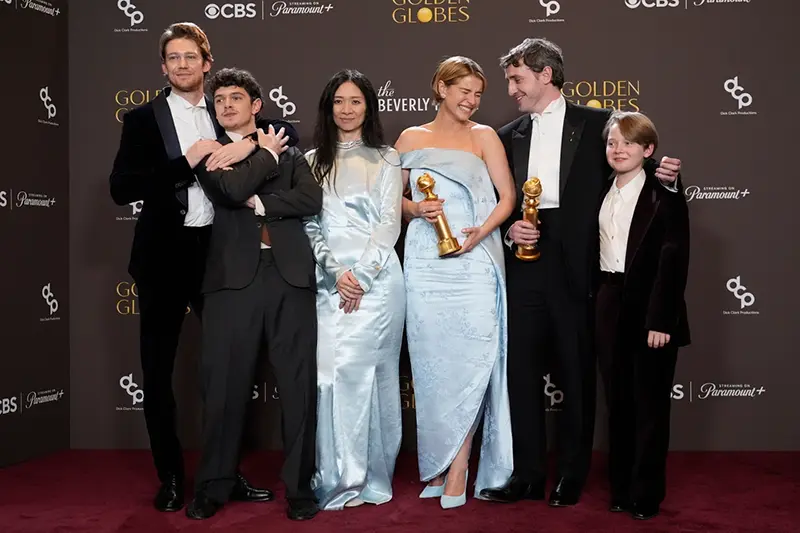 Joe Alwyn, from left, Noah Jupe, Chloe Zhao, Jessie Buckley, Paul Mescal, and Jacobi Jupe pose in the press room with the award for best motion picture - drama for “Hamnet” during the 83rd Golden Globes on Sunday, Jan. 11, 2026, at the Beverly Hilton in Beverly Hills, Calif. (AP Photo/Chris Pizzello)