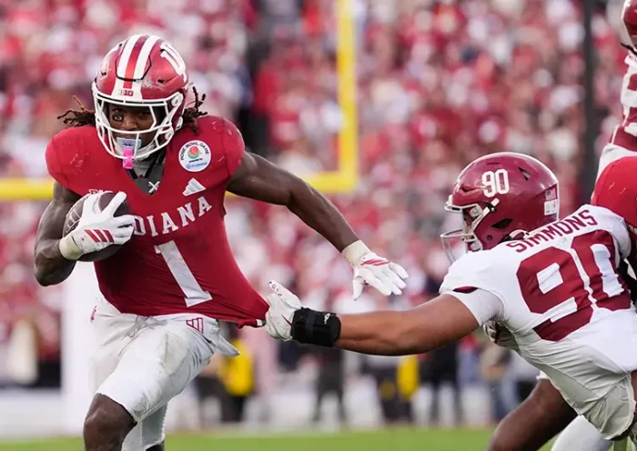 Indiana running back Roman Hemby (1) runs past Alabama defensive lineman London Simmons (90) to score a rushing touchdown during the second half of the Rose Bowl College Football Playoff quarterfinal game Thursday, Jan. 1, 2026, in Pasadena, Calif. (AP Photo/Mark J. Terrill)