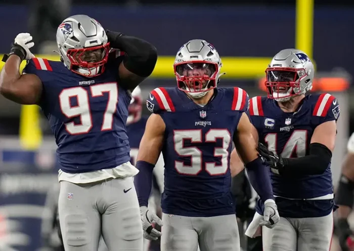 New England Patriots defensive end Milton Williams (97), linebacker Christian Elliss (53) and linebacker Robert Spillane (14) celebrate Williams’ sack of Los Angeles Chargers quarterback Justin Herbert (10) in the second half of an NFL wild-card playoff football game in Foxborough, Mass., Sunday, Jan. 11, 2026. (AP Photo/Charles Krupa)