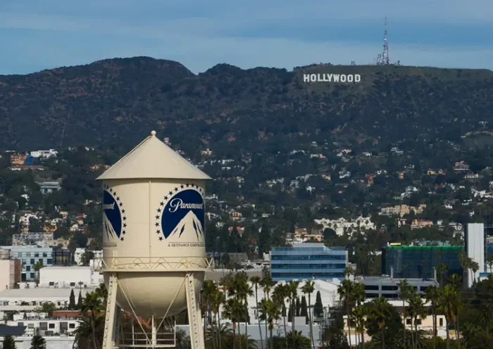 The Paramount Pictures water tower is seen in Los Angeles, Thursday, Dec. 18, 2025, with the Hollywood sign in the distance. (AP Photo/Jae C. Hong)