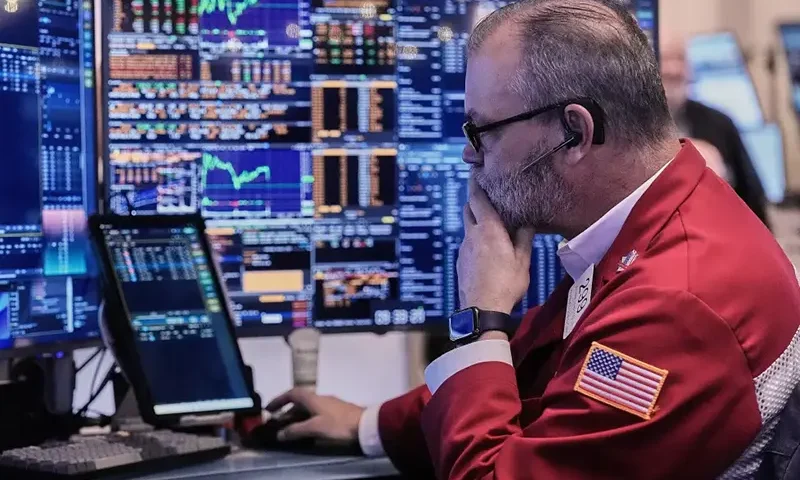 Trader William Lawrence works on the floor of the New York Stock Exchange, Wednesday, Jan. 7, 2026. (AP Photo/Richard Drew)