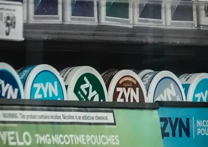 Containers of Zyn, a smokeless nicotine pouch, are displayed for sale among other nicotine and tobacco products at a newsstand on Feb. 23, 2024, in New York. (AP Photo/Bebeto Matthews, File)
