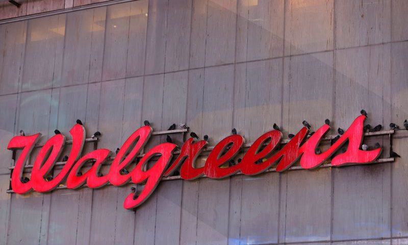 FILE PHOTO: Pigeons are seen resting on signage for Walgreens, owned by the Walgreens Boots Alliance, Inc., in Manhattan, New York City