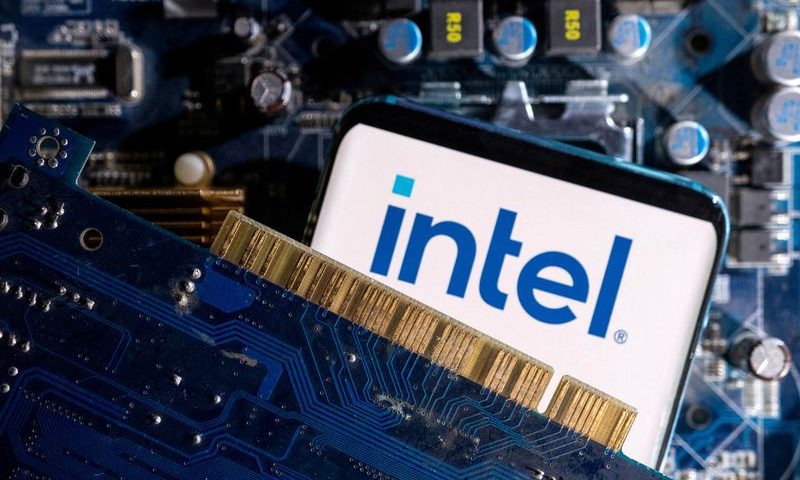 FILE PHOTO: A smartphone with a displayed Intel logo is placed on a computer motherboard in this illustration taken March 6, 2023. REUTERS/Dado Ruvic/Illustration/File Photo