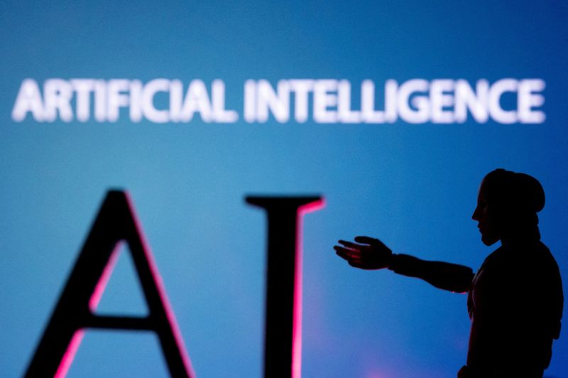 FILE PHOTO: Illustration shows AI (Artificial Intelligence) letters and robot miniature