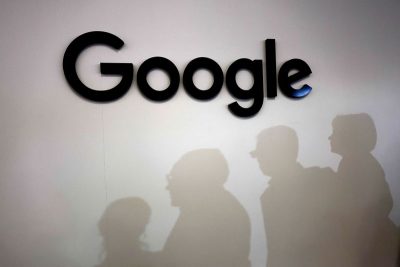 Visitors cast their shadows past the logo of Google at the Viva Technology conference dedicated to innovation and startups at Porte de Versailles exhibition center in Paris, France, June 15, 2023. REUTERS/Gonzalo Fuentes